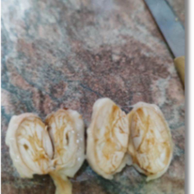 Freshly opened bean demonstrating pure white cotyledons